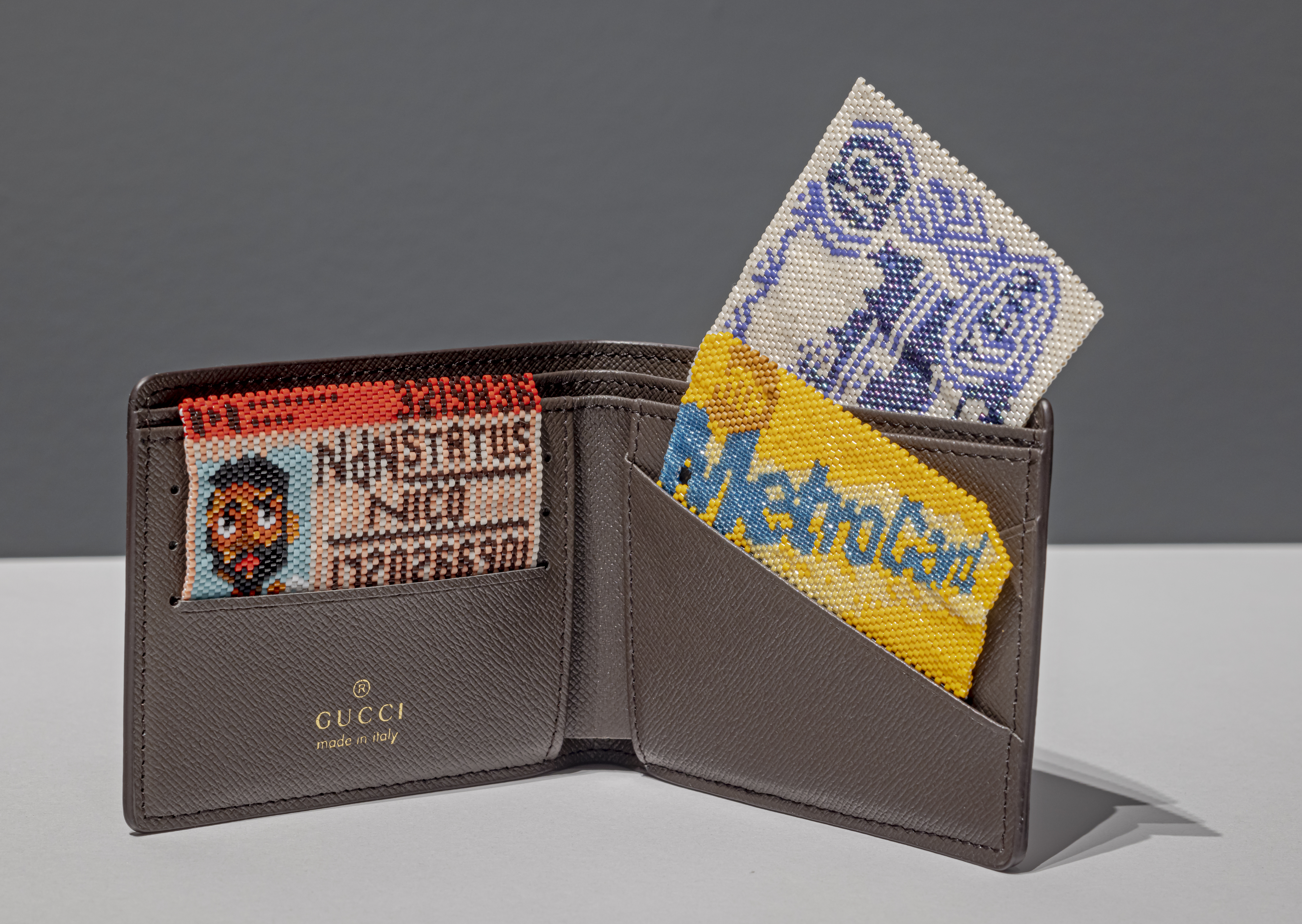 Nico Williams, Out & About, 2023; Japenese glass beads, fake Gucci GC Supreme Kingsnake wallet. From the collection of the Judith & Norman Alix Art Gallery. Gift of the artist. 