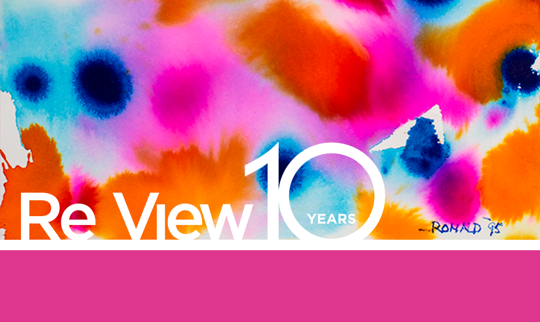 Splotches of colour with text overlay Re View 10 Year