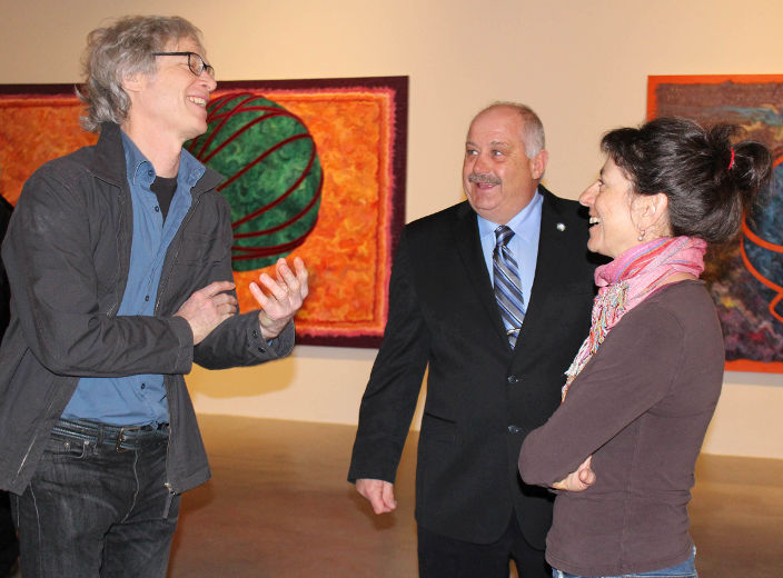 Artist Gary Spearin having conversation in the exhibition space.