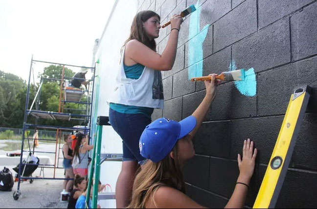 Youth painting mural