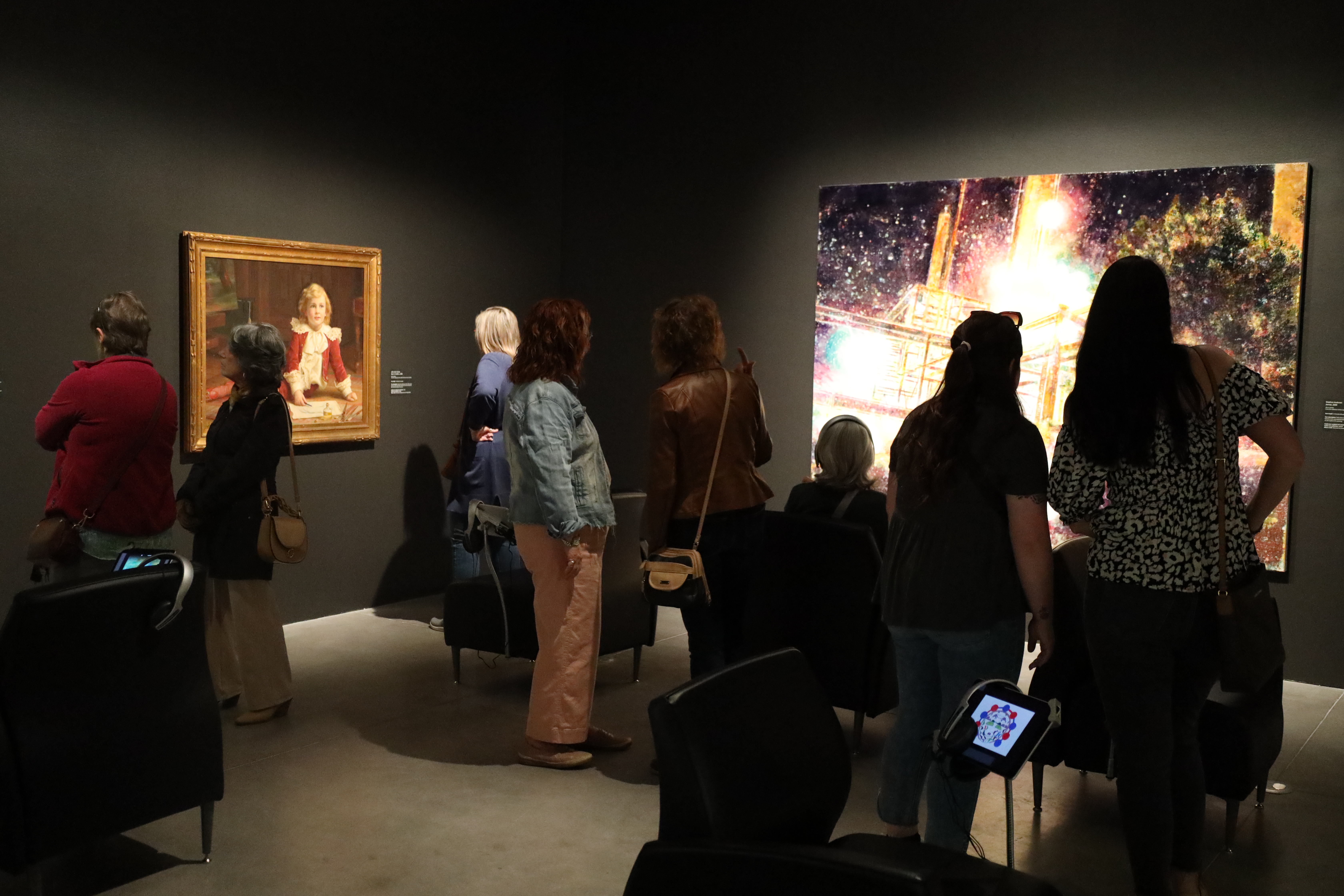 adults viewing the Gallery 3 space featuring the Re View exhibition
