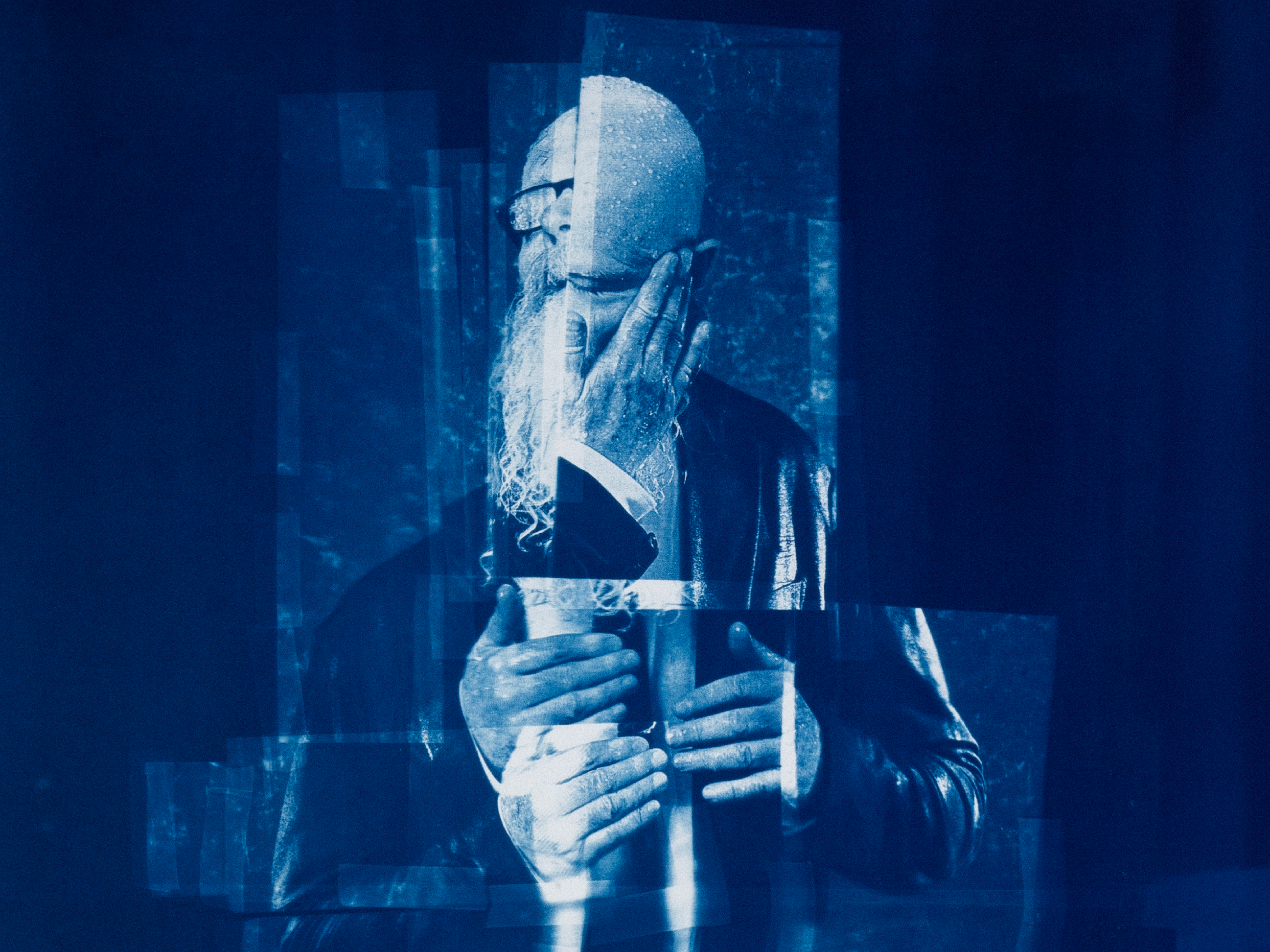 Blue-toned cyanotype portrait layered with translucent geometric shapes.