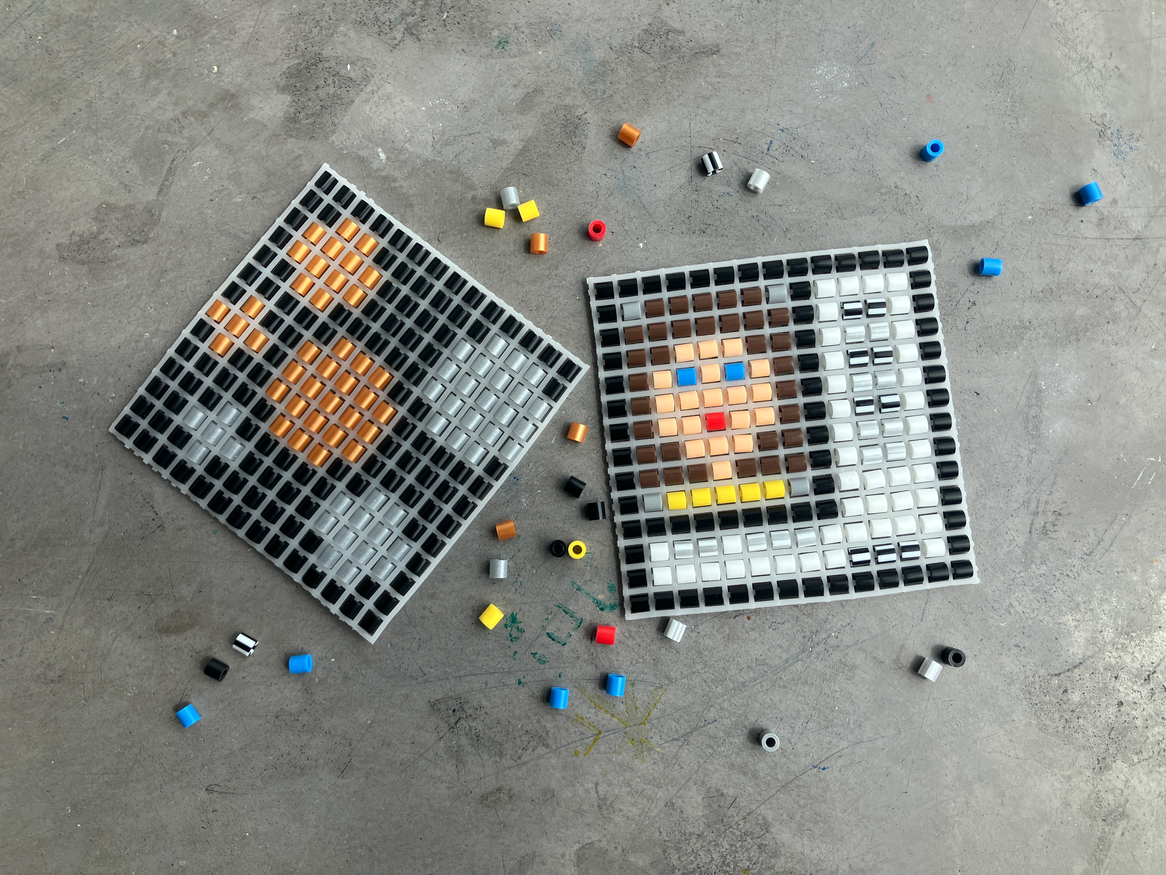 Perler beads are placed in a pattern that looks like a person's face.