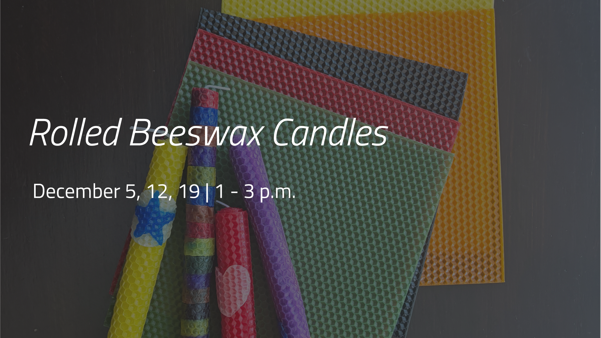 Colourful rolled beeswax candles displayed alongside sheets of textured beeswax.