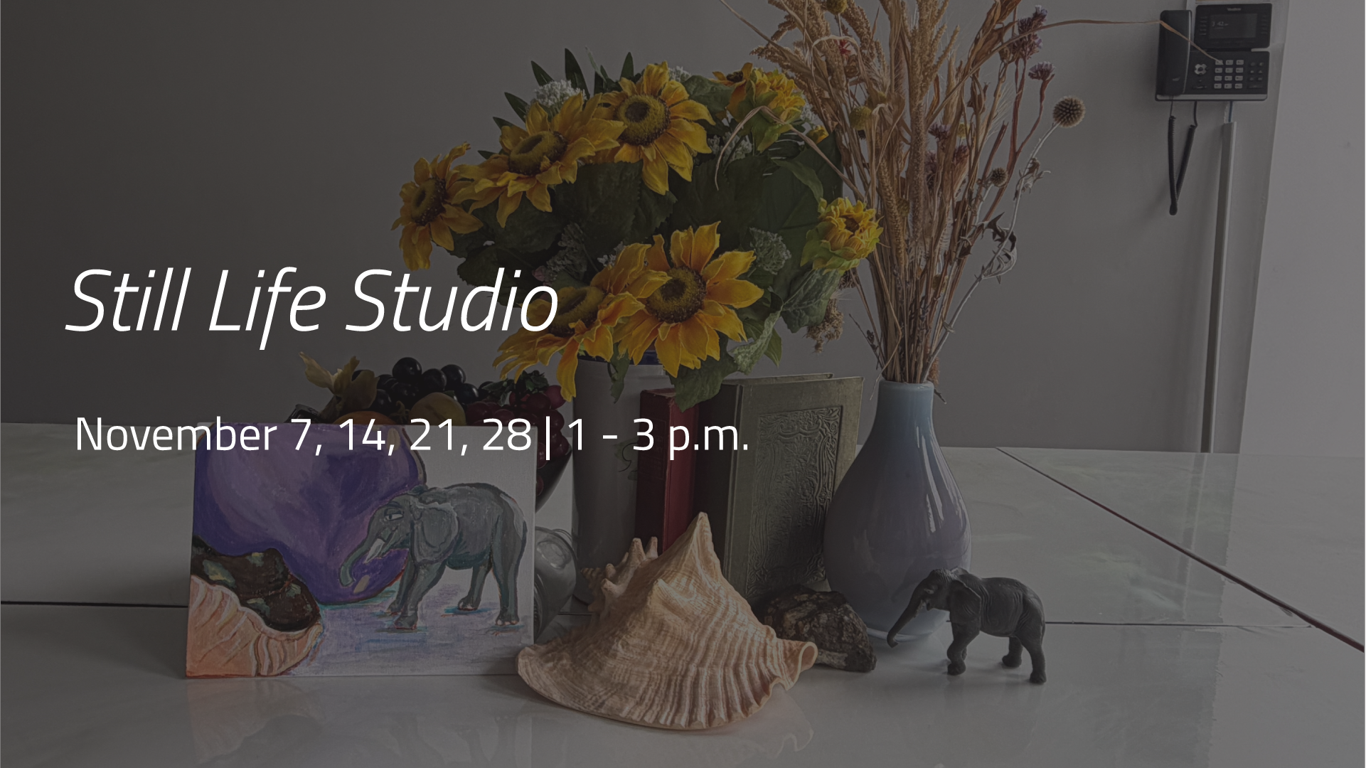 Still life arrangement with sunflowers, books, shells, fruit, and small elephant figurines on a table.