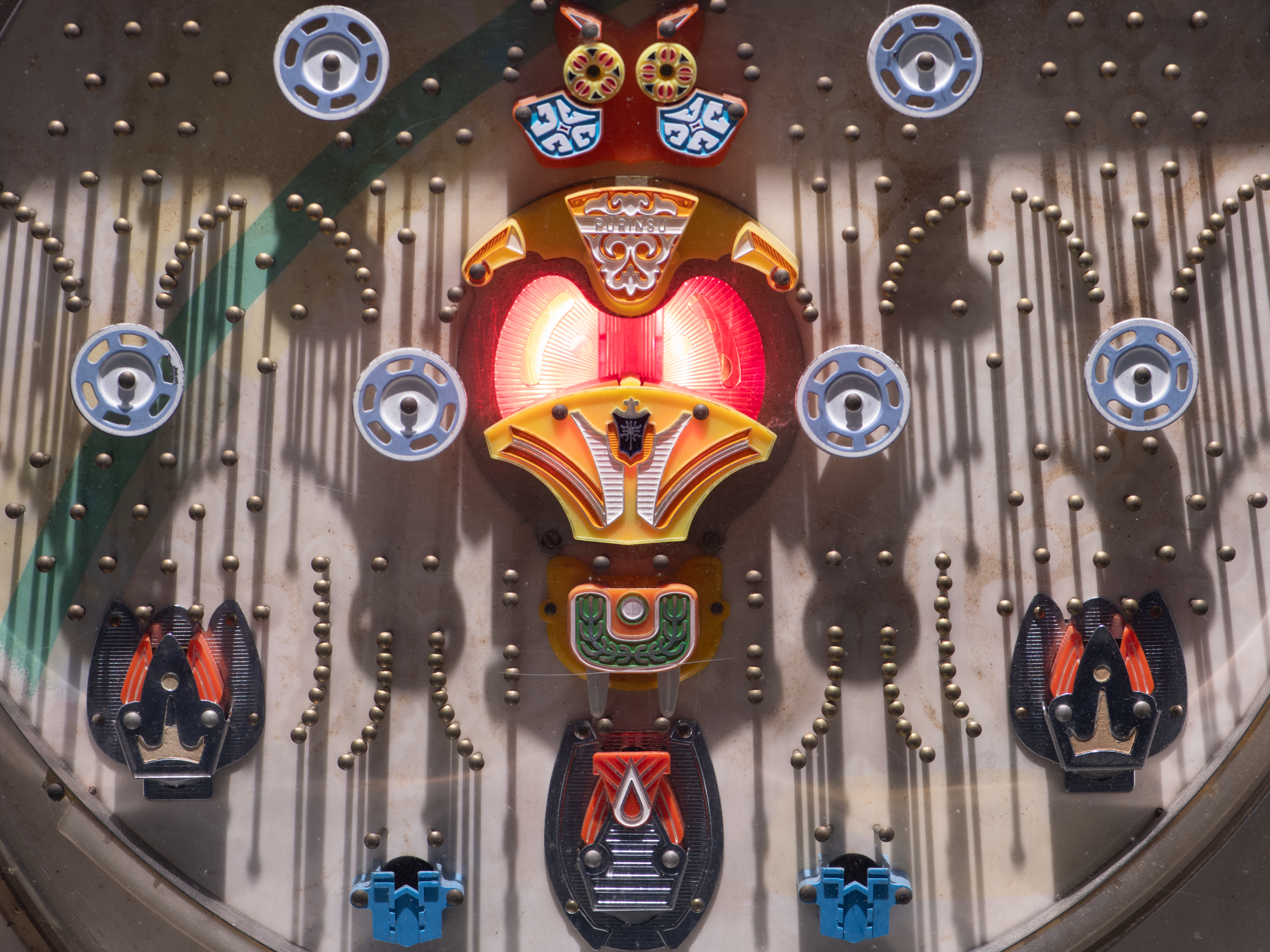 Reva Stone, Pachinko (detail), 2015; mixed media: Pachinko machine, Pachinko balls, Plexi shields, embedded Foxconn computer, HDMI screen, custom software, motor, custom pulley device, Arduino board and rotary encoder