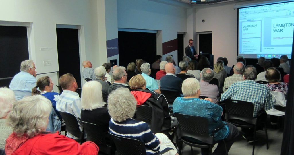 Patrons listening to Alec Moore's lecture