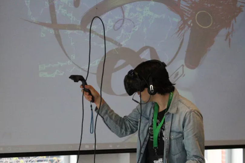 youth participating in virtual-reality painting session