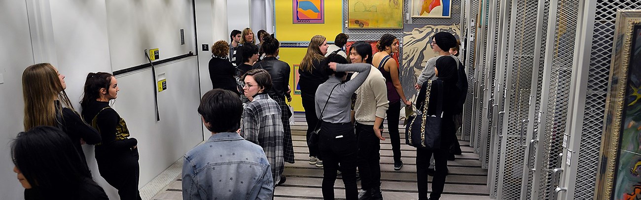 High school students touring the art gallery collections vault