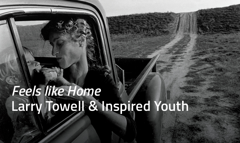 Woman and child sitting in car - text overlay Feels Like Home Larry Towell and Inspired Youth