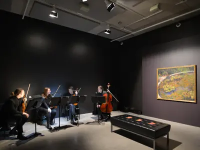 The International Symphony Orchestra performing in the ReView 5 exhibition space.