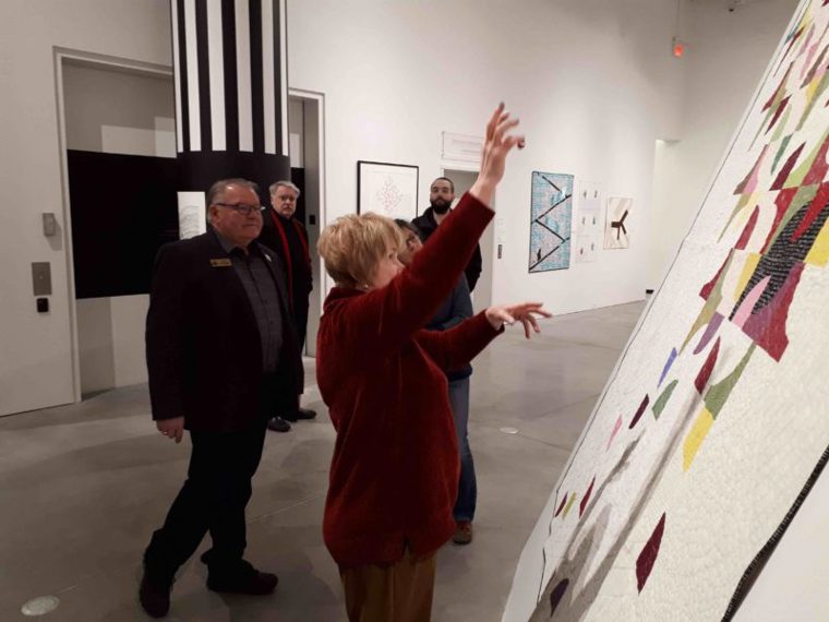 Local dignitaries viewing quilt exhibition